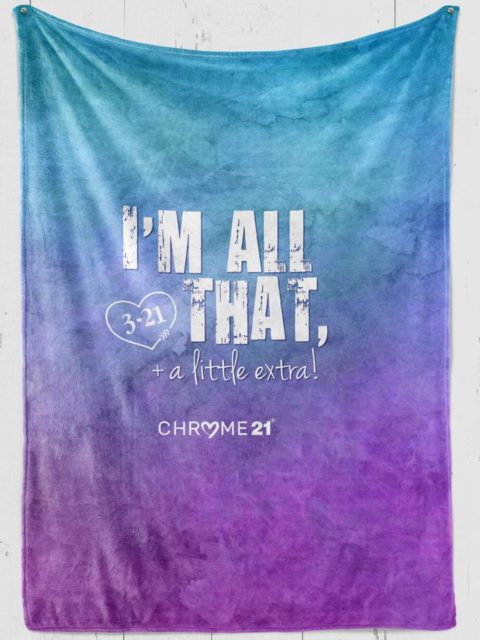 down syndrome blanket blue and purple plush with white text 'I'm all that + a lil extra'