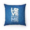 blue down syndrome awareness pillow with white and light blue text 'love being me' 3.21