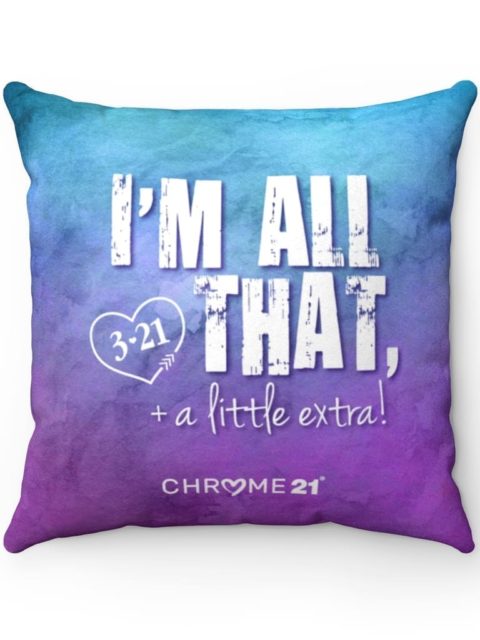 Blue and purple down syndrome awareness pillow with white text 'I'm all that + a little extra'