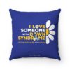 blue down syndrome awareness pillow with yellow and white daisy and yellow and white text 'I love someone with down syndrome and they make my life extraordinary'