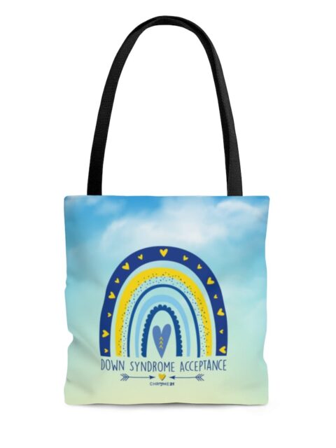 down syndrome acceptance tote bag blue cloudy sky with yellow and blue rainbow and text 'down syndrome acceptance'