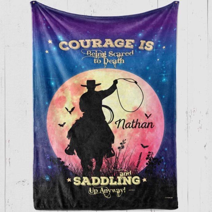 Personalized Cowboy blanket on moonscape and stars background with cowboy and bats flying 'Courage is being scared to death [name] and saddling up anyway!'