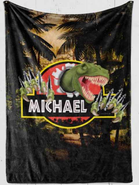 Personalized Blanket with Jurassic Era Dinosaur in jungle scratching through the blanket and with [name] personalization