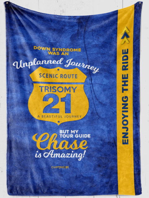 Custom blanket for Down Syndrome Awareness on blue plush fleece with yellow road sign and yellow and blue text 'Down syndrome was an unplanned journey but my tour guide [name] is Amazing!'